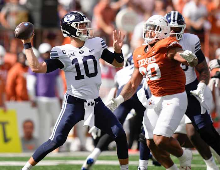 BYU Cougars quarterback Kedon Slovis throws under pressure from Texas Longhorns defensive lineman Byron Murphy II. © Jay Janner/American-Statesman / USA TODAY NETWORK